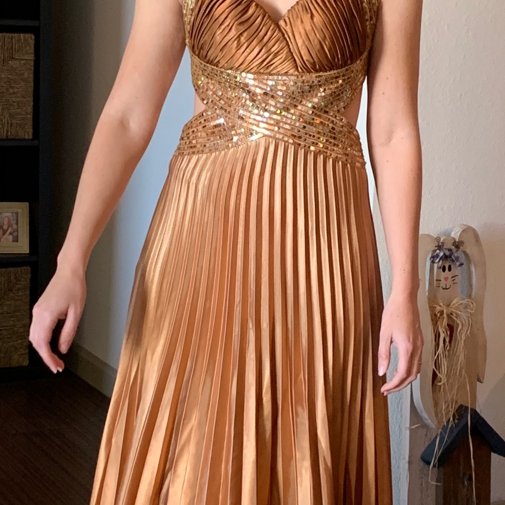 Accordion pleated copper colored prom gown